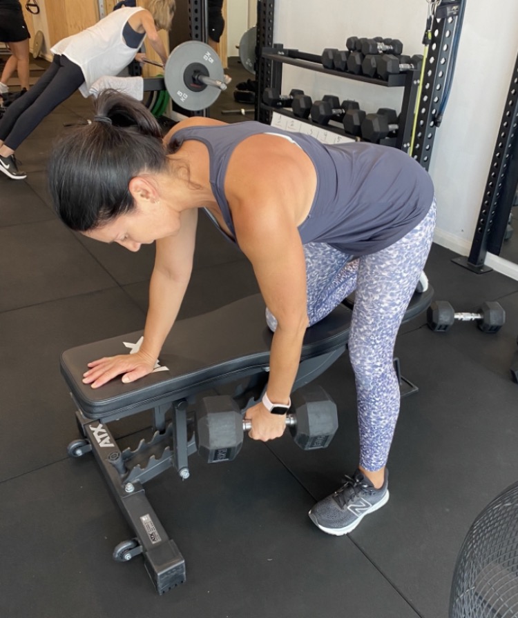 Client doing a single-arm dumbbell row at The Fitness Space studio in Maroubra