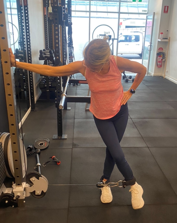 Returning to exercise: cable hip training at The Fitness Space, Maroubra Woman doing standing cable hip training at The Fitness Space studio in Maroubra